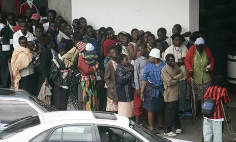 Zimbabwe. People Queue For Bread Outside A Harare Supermarket.. Stock Photos