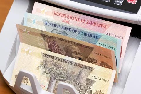Zimbabwean dollar in the counting machine Stock Photos