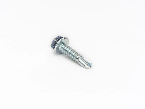 Zinc plated hexagonal head self drilling point screw bolt shot on white. Stock Photos