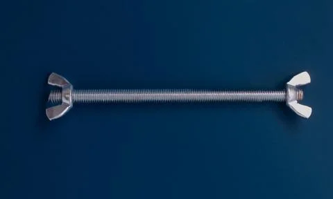 Zinc-plated stud with two wing nuts, connected parts Stock Photos