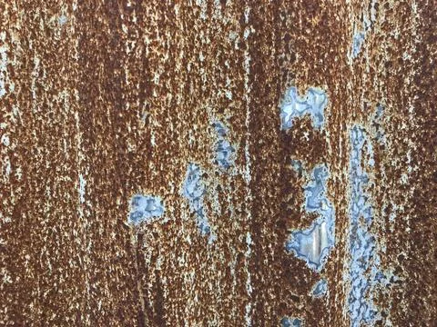 Zinc sheet full of brown rust and showing some original silver color Stock Photos