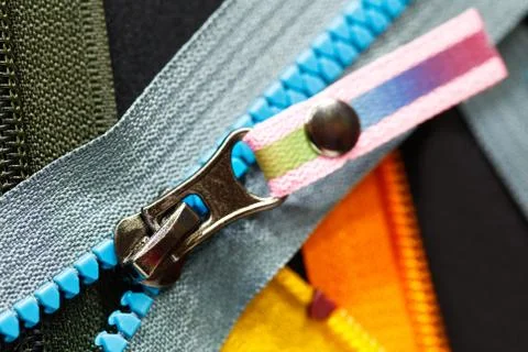 Zip background texture of zippers sliders. a lot of zippers in different colo Foto stock