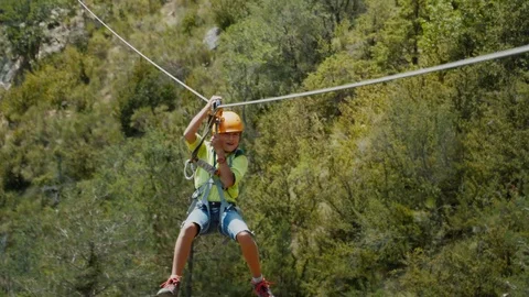 Zip line in mountains, a cable between rocks. Moving with zipline at via ferrata Video stock 126494462