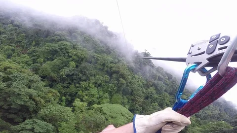 Zip line through rainforest POV with clouds Stock Footage 93095374