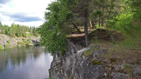 Zipline over the lake in the rocks Stock Footage 340029367