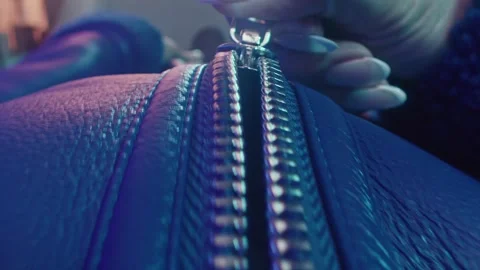 Zipper Being Pulled Up on a Dark Blue Leather Jacket Stock Footage 331098783