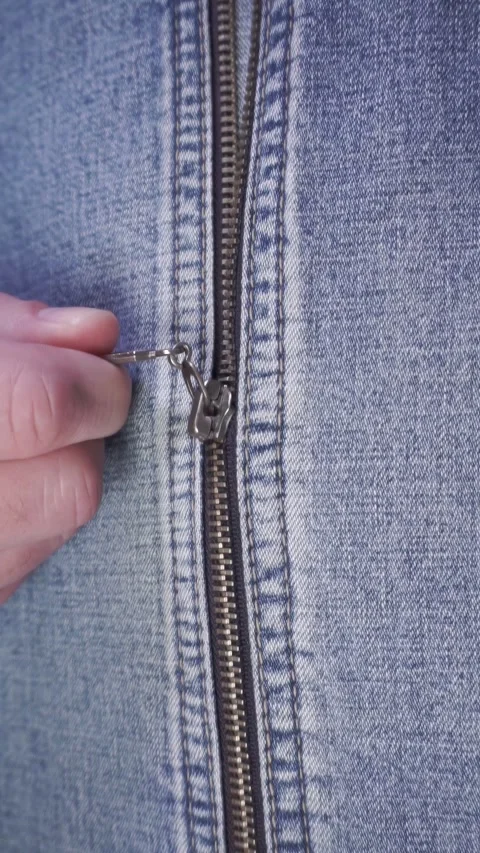A zipper being zipped up in close-up Stock Footage 284746000