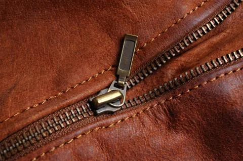 Zipper of a brown leather jacket Stock Photos