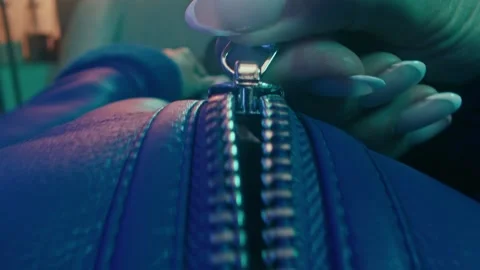 Zipper Closing on a Blue Leather Jacket for a Fashion Transition Detail 库存影片 331099054