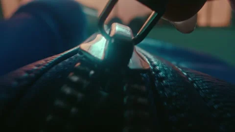 Zipper Closing on a Dark Leather Bag with Cinematic Moody Lighting Close Up Vidéo 331098581