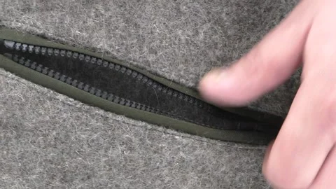 Zipper lock on the pocket of the wool jacket. Stock Footage 151670659