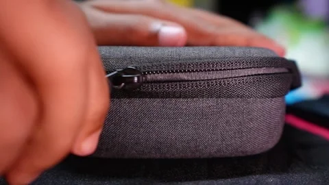 Zipper is opening by hand Stock Footage 320316444