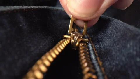 Zipper on a pair of jeans being pulled up Stock Footage 150481916