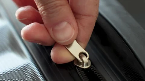 Zipper on suitcase, close-up. Hands close zipper of a black travel luggage Stock Footage 272436789