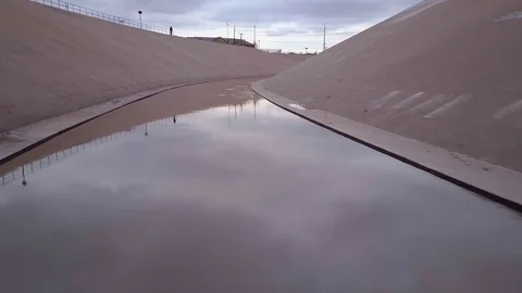 Zipping Down a Cement Arroyo to some Abandoned Grocery Carts Stock Footage 72892279
