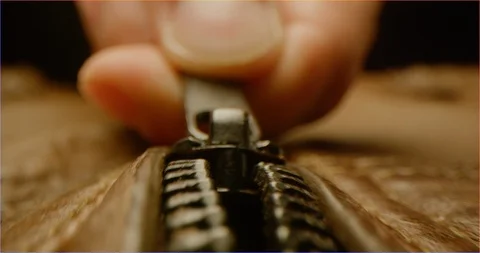 Zipping up a leather jacket macro shot Stock Footage 126265955