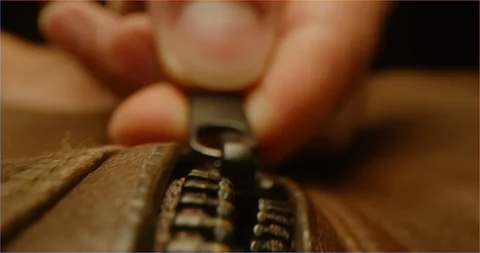 Zipping up a leather jacket macro shot Stock Footage 126265980