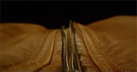 Zipping up a leather jacket macro shot 스톡 동영상 126266146