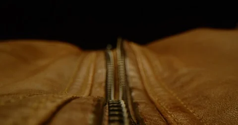 Zipping up a leather jacket macro shot Stockbeeldmateriaal 126266156