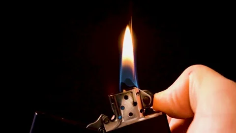 Zippo lighter on black background Stock Footage