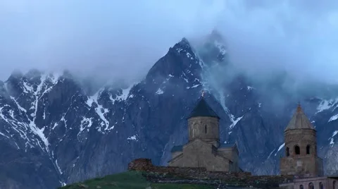 Zminda Sameba pilgrimage church, High Caucasus, in clouds, Stepanzminda, Georgia Stock Footage 40929894