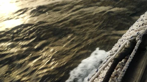 A zodiac cutting through the sun lit waters of the Galapagos (4K). Stock Footage 342119363