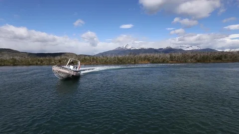 Zodiac tour boat pulls up to dock in Patagonia Stock Footage 123407796