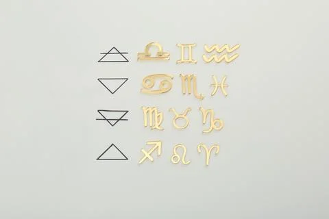 Zodiac triplicity. Four elements and corresponding signs on grey background.. 스톡 사진