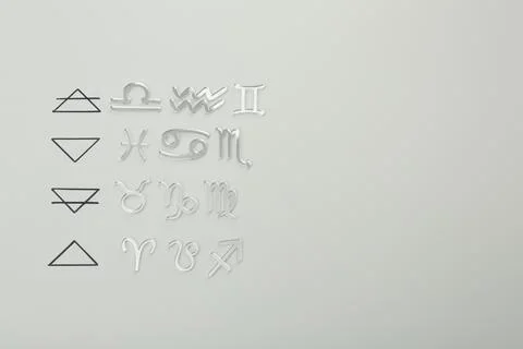 Zodiac triplicity. Four elements and corresponding signs on grey background.. 스톡 사진