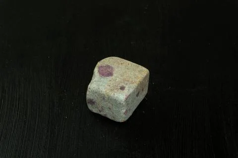 Zoisite, saualpite or ruby in the host rock. Natural mineral stone on a black 写真素材