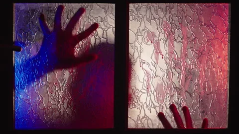 Zombie Attack Through Glass Door, Two Hands and Head Silhouette Behind Glass Stock Footage 295011013