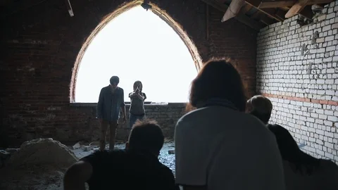 A zombie attack on the top floor of abandoned building. A man survivor tries to Stock Footage 110737359