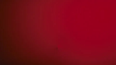 Zombie face behind the red fabric Stock Footage 317619423