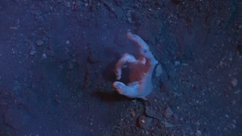 Zombie hand emerges from the ground Stock Footage 286046850