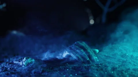 Zombie hand knocks fingers nervously on grave. Creepy halloween moment, undead. Stock Footage 253789510