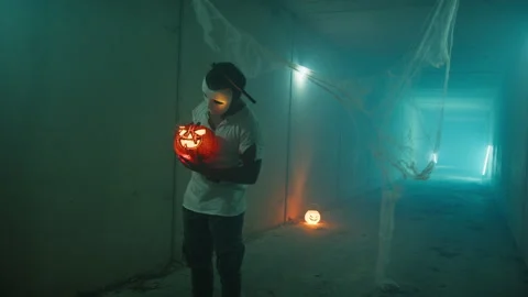 Zombie Killer Caressing Jack O Lantern Stock Footage 317621035