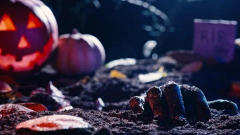 Zombie man hand crawl in soil on grave. Creepy halloween moment, undead.Cemetery Stock Footage 253997578