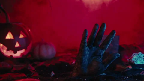 Zombie man hand waving hello, hi, greeting. Footage of scary halloween, pumpkin Stock Footage 253997955