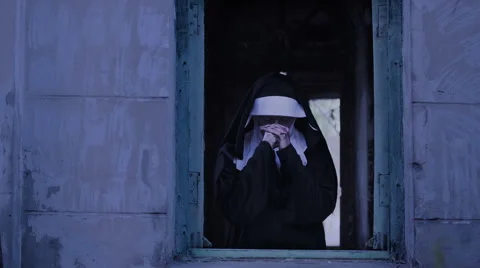 Zombie nun. devilish woman in nun costume walking around the temple. halloween Stock Footage