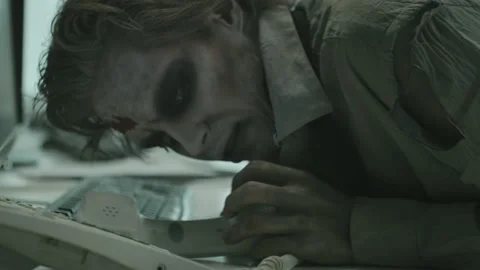 Zombie Office Worker Trying to Answer Phone Stock Footage 154295413