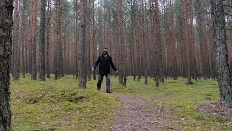 Zombie in scary skeleton mask walking in forest. Stock-Footage 154475882
