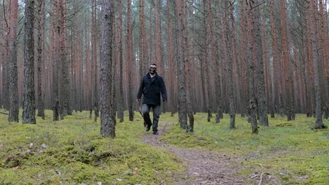 Zombie in scary skeleton mask walking in forest. Stock-Footage 154476008