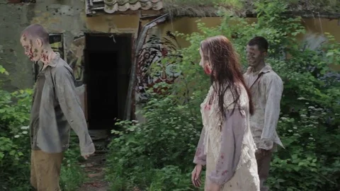Zombies are walking through an abandoned village. Stock Footage 77441841