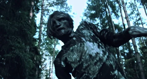 Zombies are walking through the woods. Video stock 66863436
