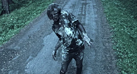 Zombies are walking through the woods. 库存影片 66864373