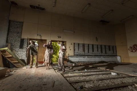 Zombies attack in an abandoned dark building Stock Photos