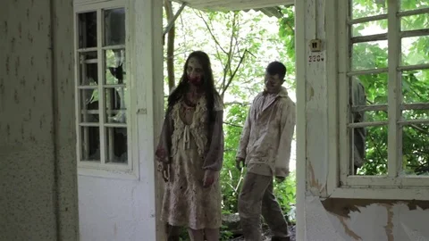 Zombies come in an abandoned house. Video stock 77444029