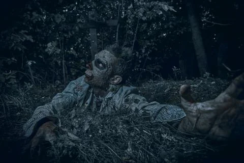 Zombies risen in the night cemetery. Halloween. Thriller. Stock Photos