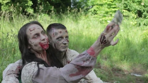 Zombies take a selfie outdoor. 스톡 동영상 77453215