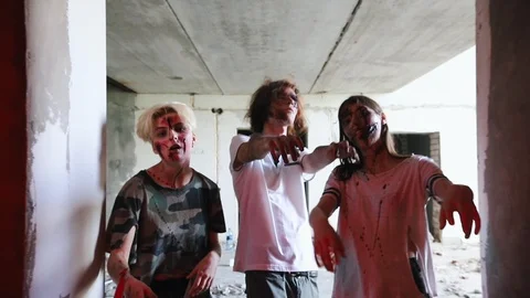 Zombies walking in the dark corridor in red lighting Stock Footage 110740847